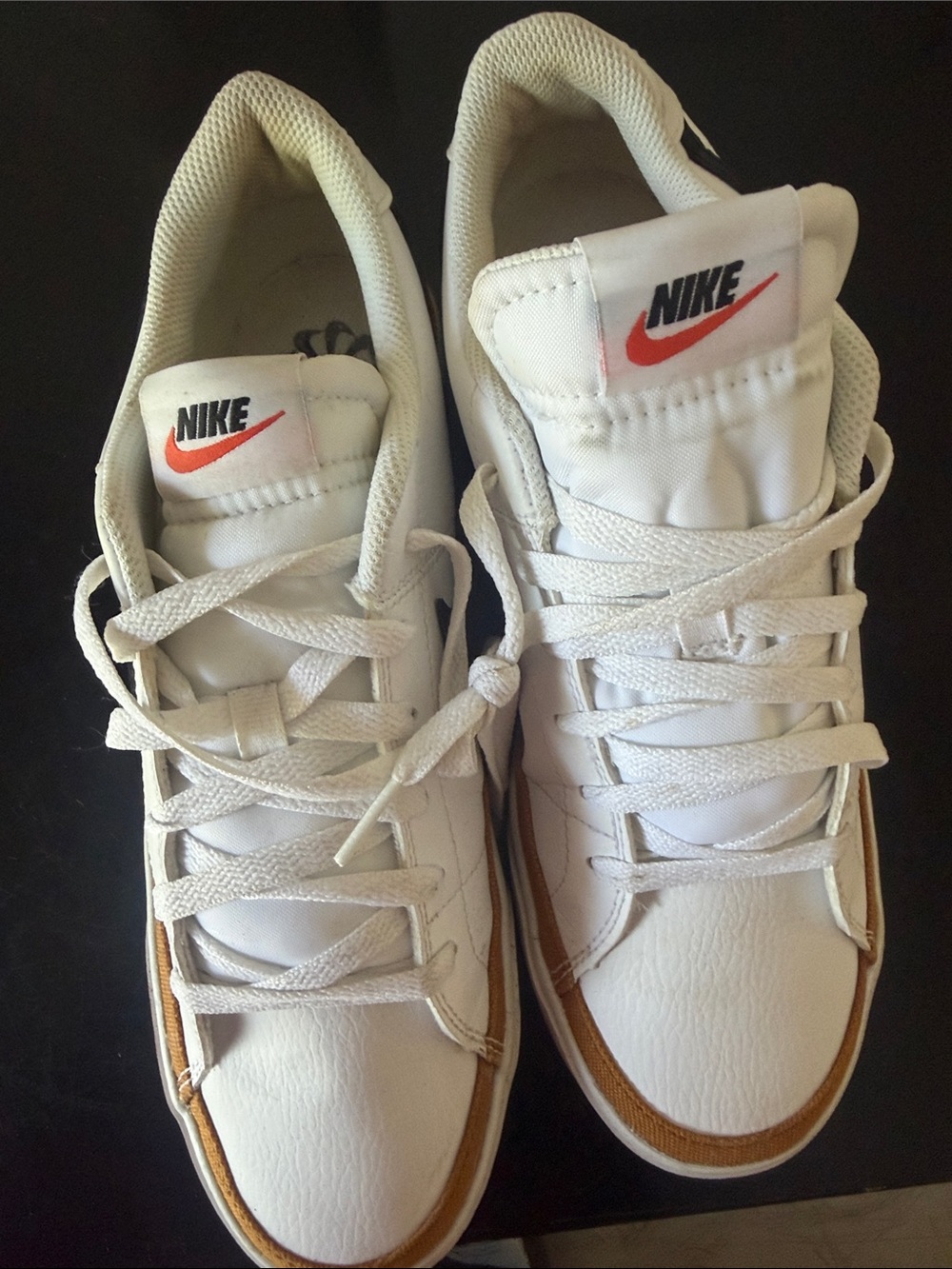 Nike White Leather Sneakers with Brown Trim and Orange Swoosh